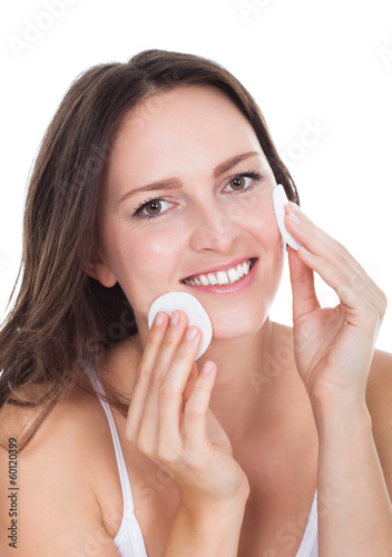 Photo: Woman Cleaning Face With Cotton Woman Cleaning Face With Cotton
