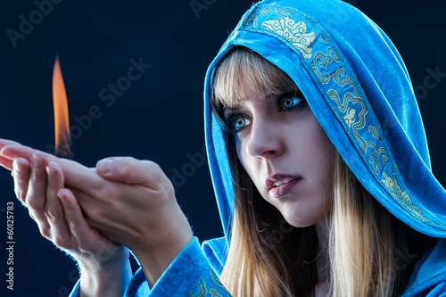 Photo: magician holding flame magician holding flame