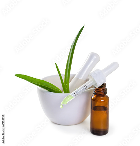 Photo: Juice and aloe leaves. Isolate on white background Juice and aloe leaves. Isolate on white background