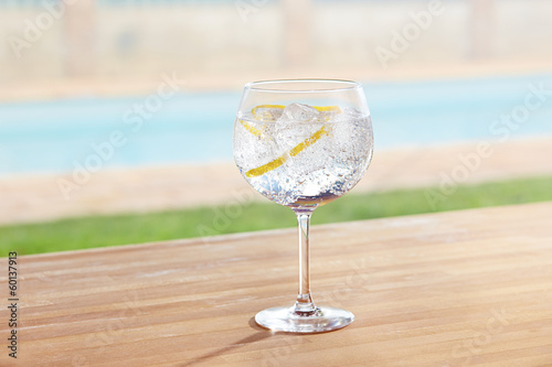 Photo: Gin and tonic cocktail on poolside Gin and tonic cocktail on poolside