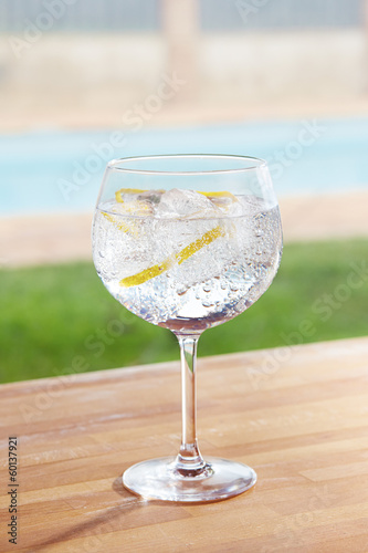Photo: Gin and tonic cocktail on poolside Gin and tonic cocktail on poolside