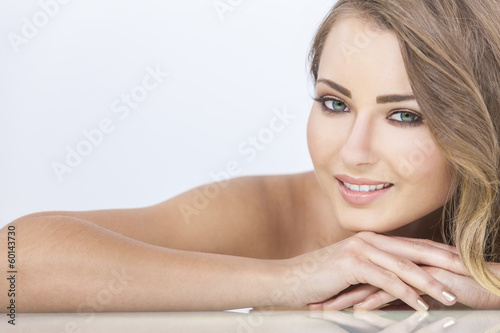 Photo: Smiling Beautiful Woman Resting on Hands Smiling Beautiful Woman Resting on Hands