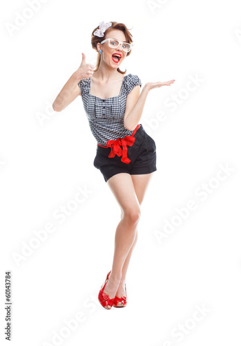 Photo: Smile young woman standing and holding something Smile young woman standing and holding something