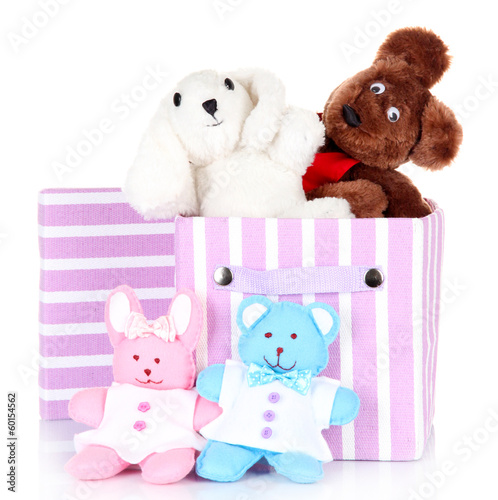 Photo: Textile box with toys, isolated on white Textile box with toys, isolated on white