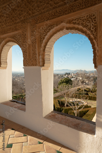 Photo: Arches of Generalife palace in Alhambra with garden view Arches of Generalife palace in Alhambra with garden view
