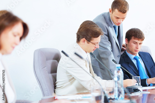 Photo: Four businesspeople at meeting Four businesspeople at meeting