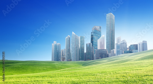 Photo: spring field and modern city spring field and modern city