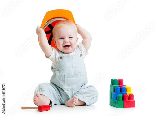 Photo: child with hard hat and building blocks child with hard hat and building blocks