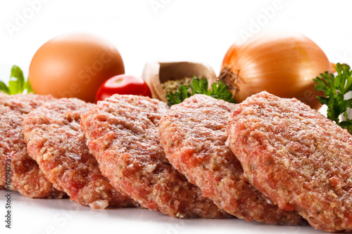 Photo: Raw minced pork chops meat on white background Raw minced pork chops meat on white background