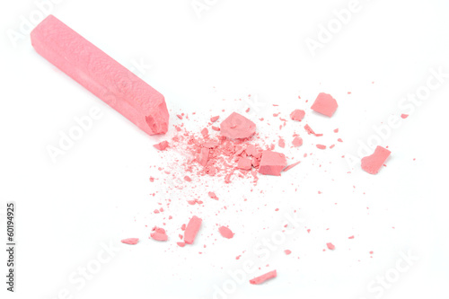 Photo: Crumbled pink chalk on white background Crumbled pink chalk on white background