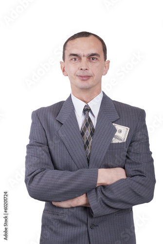 Photo: Young businessman in a suit and with dollars in his pocket. Young businessman in a suit and with dollars in his pocket.