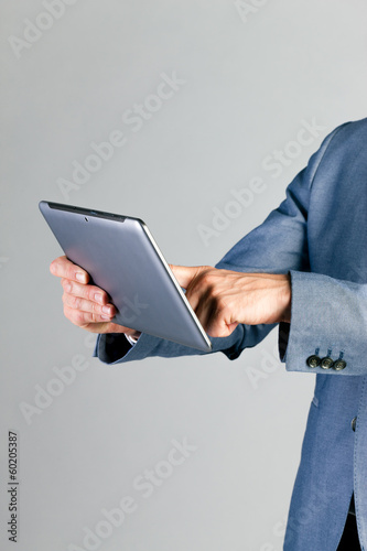 Photo: Businessman using tablet computer Businessman using tablet computer