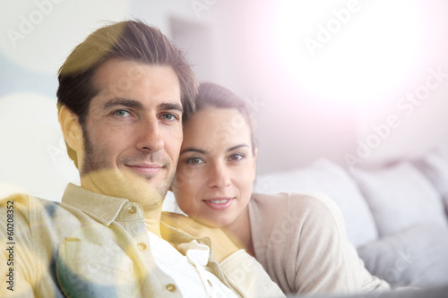 Photo: Couple at home relaxing in sofa Couple at home relaxing in sofa