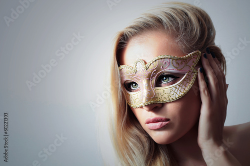 Photo: Beautiful Blond Woman in a Carnival Mask.Masquerade. Sexy Girl Beautiful Blond Woman in a Carnival Mask.Masquerade. Sexy Girl