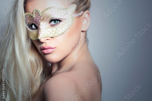 Photo: Beautiful Blond Woman in a Carnival Mask.Masquerade. Sexy Girl Beautiful Blond Woman in a Carnival Mask.Masquerade. Sexy Girl