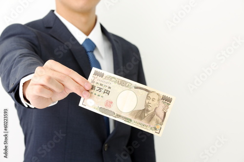 Photo: お金を持つビジネスマン お金を持つビジネスマン