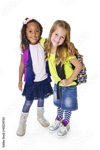 Photo: Cute Diverse young school students isolated on white Cute Diverse young school students isolated on white