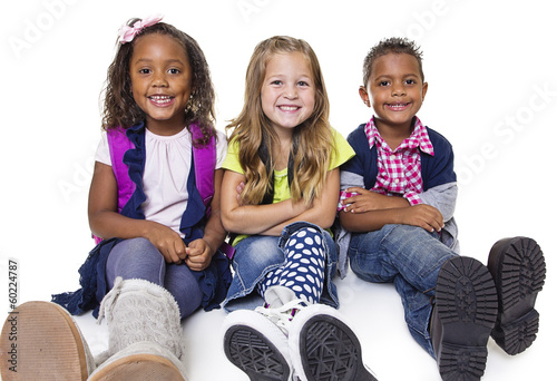 Photo: Diverse group of school kids isolated on white background Diverse group of school kids isolated on white background