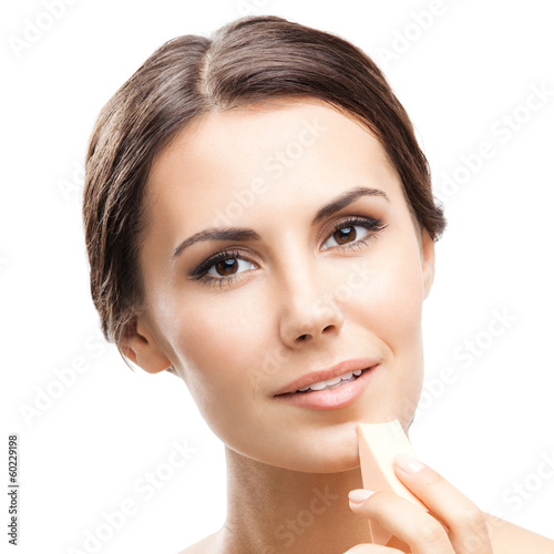 Photo: Young woman cleaning skin by cotton pad Young woman cleaning skin by cotton pad