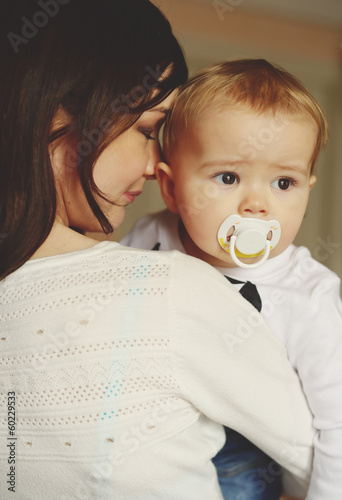 Photo: mother holding baby son mother holding baby son