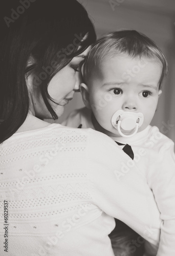 Photo: mother holding baby son mother holding baby son