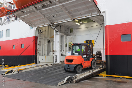 Photo: Big passenger ship loading with lift truck Big passenger ship loading with lift truck