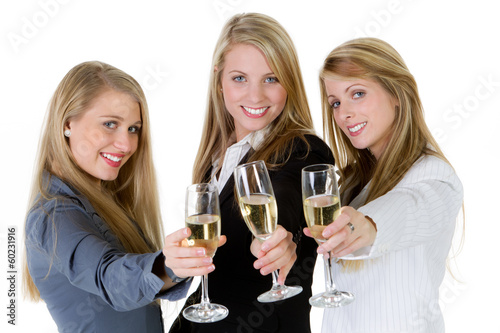 Photo: three women holding glasses three women holding glasses