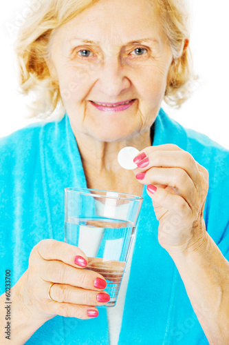 Photo: Senior Woman Holding Water Glass And Tablet Senior Woman Holding Water Glass And Tablet