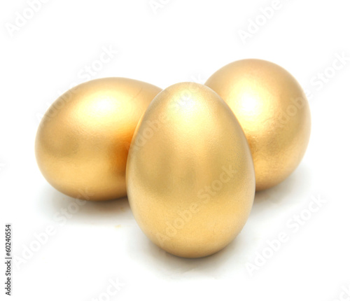 Photo: Golden egg isolated on white background Golden egg isolated on white background