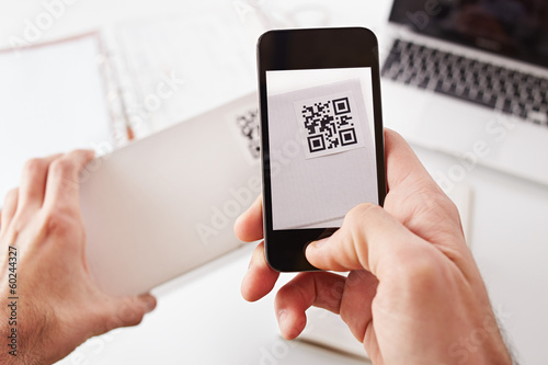 Photo: Smartphone taking photo of QR code Smartphone taking photo of QR code