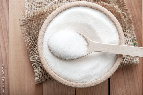 Photo: sugar in a wooden bowl sugar in a wooden bowl