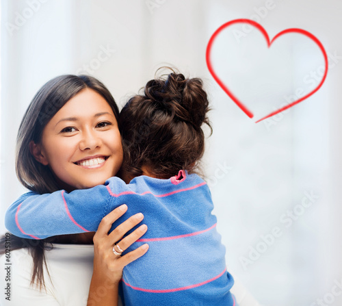 Photo: hugging mother and daughter hugging mother and daughter