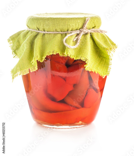 Photo: Preserved red sweet peppers isolated on white Preserved red sweet peppers isolated on white
