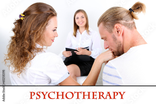 Photo: Young couple with problem on reception for family psychologist Young couple with problem on reception for family psychologist