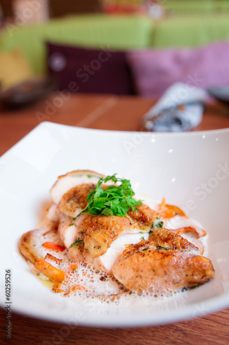 Photo: Chicken breast with baby vegetables on plate Chicken breast with baby vegetables on plate
