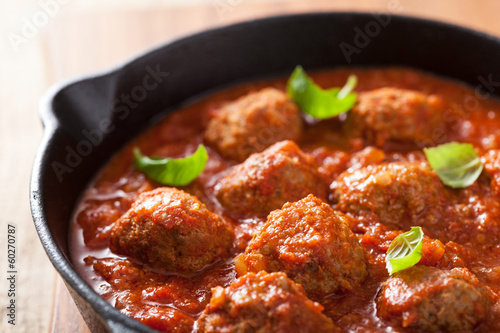 Photo: meatballs with tomato sauce in black pan meatballs with tomato sauce in black pan