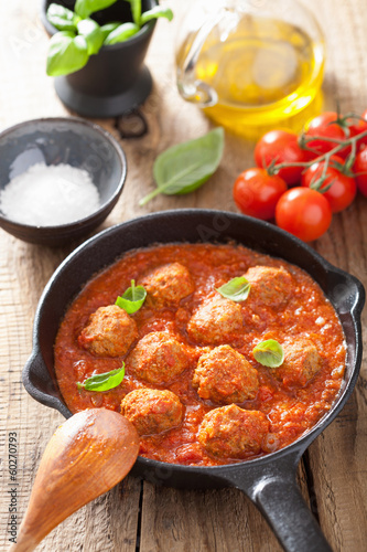 Photo: meatballs with tomato sauce in black pan meatballs with tomato sauce in black pan