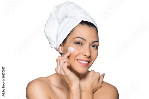 Photo: Beautiful Woman Applies Lotion to Her Face Beautiful Woman Applies Lotion to Her Face