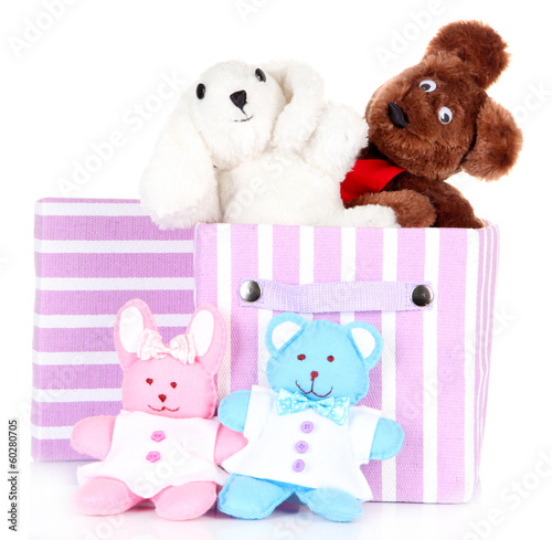 Photo: Textile box with toys, isolated on white Textile box with toys, isolated on white