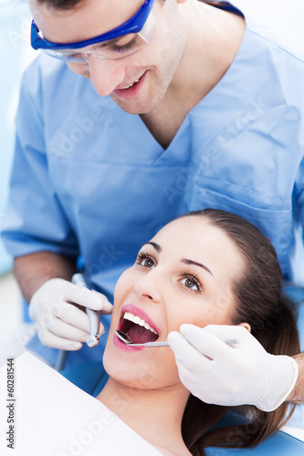 Photo: Male dentist with female patient Male dentist with female patient