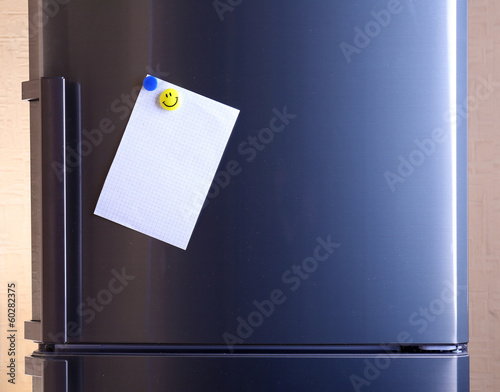 Photo: Empty paper sheet on fridge door Empty paper sheet on fridge door