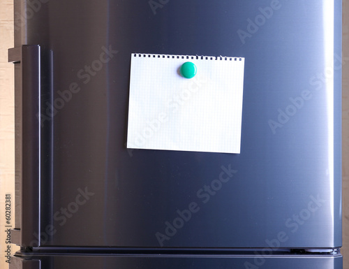 Photo: Empty paper sheet on fridge door Empty paper sheet on fridge door