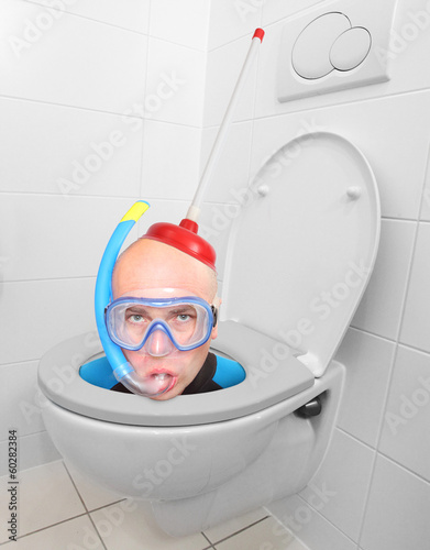 Photo: Funny picture from hotel bathroom. Crazy scuba diver in the WC. Funny picture from hotel bathroom. Crazy scuba diver in the WC.