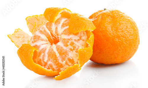 Photo: Ripe sweet tangerines, isolated on white Ripe sweet tangerines, isolated on white