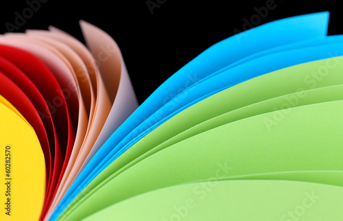 Photo: Colorful art paper on black background Colorful art paper on black background