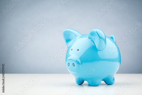 Photo: Blue Piggy Bank on a Table Blue Piggy Bank on a Table