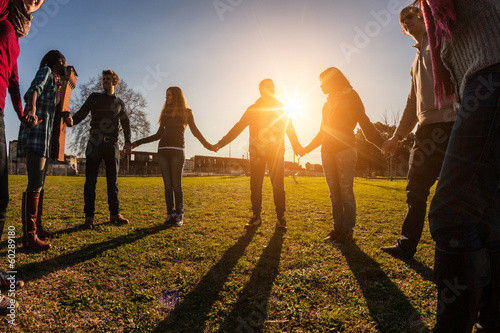 Photo: Multiracial Young People Holding Hands in a Circle Multiracial Young People Holding Hands in a Circle