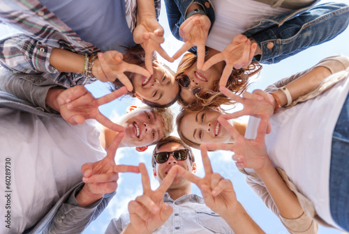 Photo: group of teenagers showing finger five group of teenagers showing finger five
