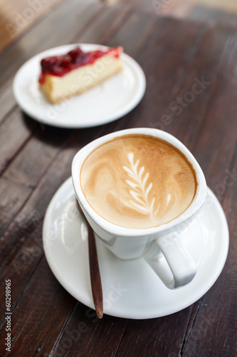 Photo: Cup of latte coffee with cake Cup of latte coffee with cake