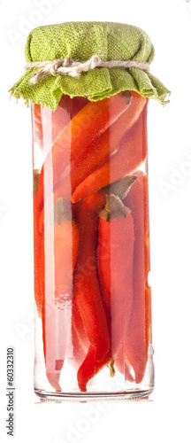 Photo: Preserved red hot chili peppers isolated on white Preserved red hot chili peppers isolated on white